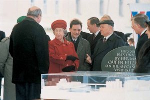 The Mayor of Moscow shows Her Majesty the model of the new embassy. Richard Burton is at left, facing The Queen.