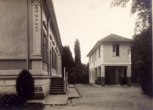 Chancery and garage added for year-round residence use in 1928.