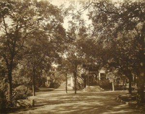 View west across compound from inside main gate, with bell to the right.