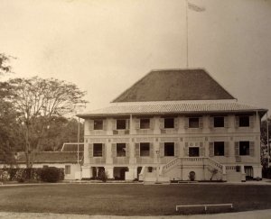 Residence from within the compound, with flagstaff and river beyond, late 1890s.
