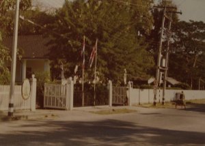 Entrance to the (by then closed) consulate, 1974. The Queen Victoria statue is just visible between the two flags.