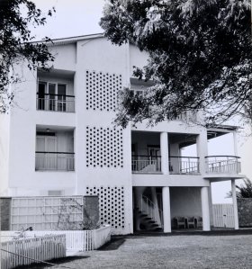 East end of building, with first floor residence terrace around dining and drawing rooms, with stair down to garden,1960s.